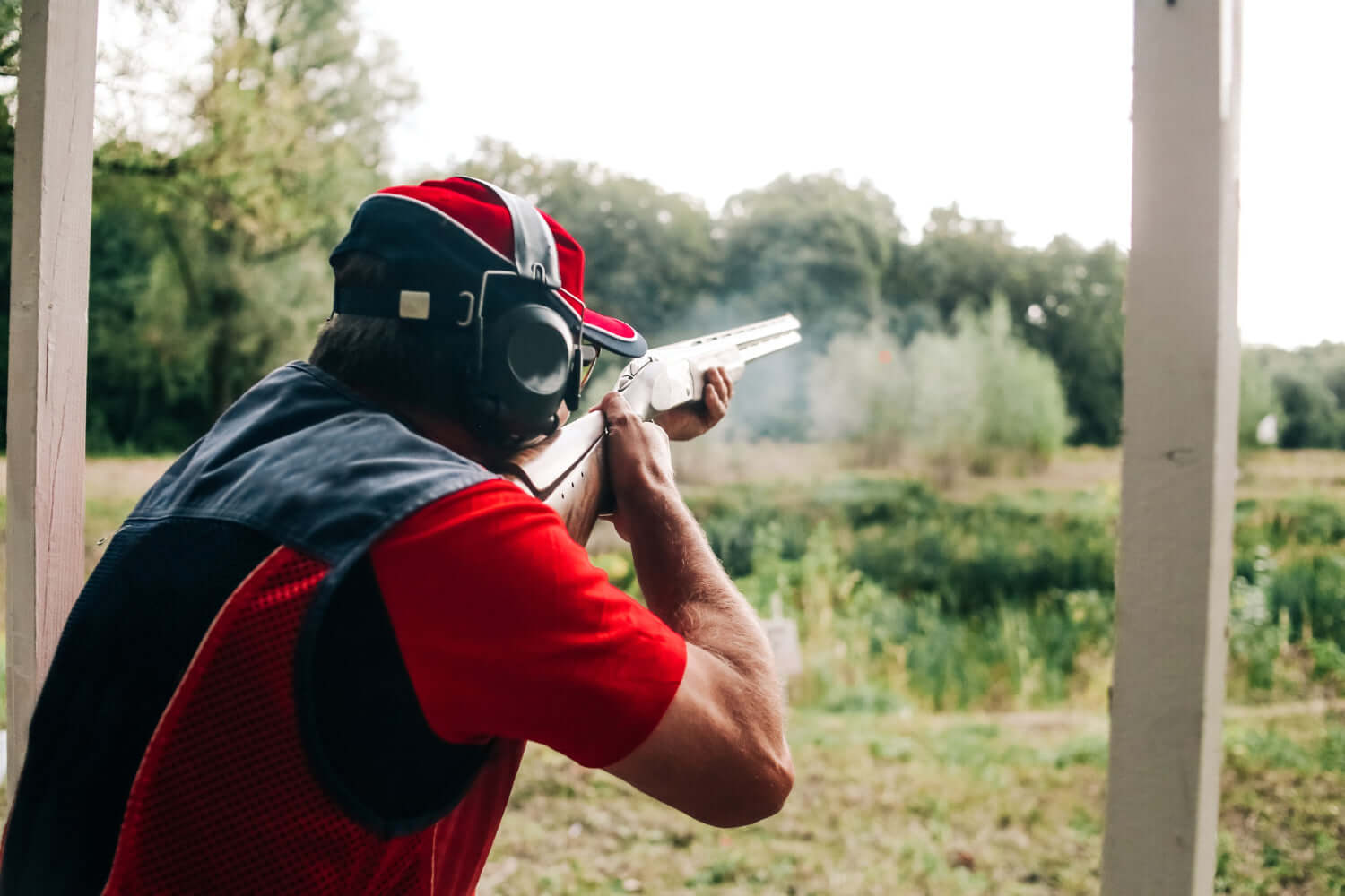 Person wearing hearing protection while shooting, demonstrating why should you wear hearing protection when shooting.