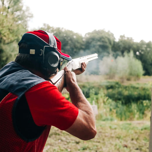 Person wearing hearing protection while shooting, demonstrating why should you wear hearing protection when shooting.