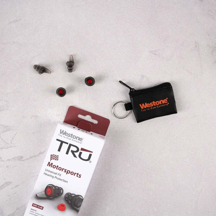 TRU Motorsports Universal Fit Hearing Protection packaging and earplugs on a marble surface.